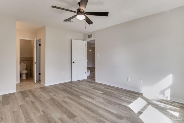 unfurnished bedroom with baseboards, visible vents, and light wood-style floors