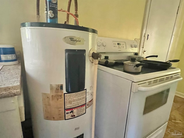 utility room featuring electric water heater