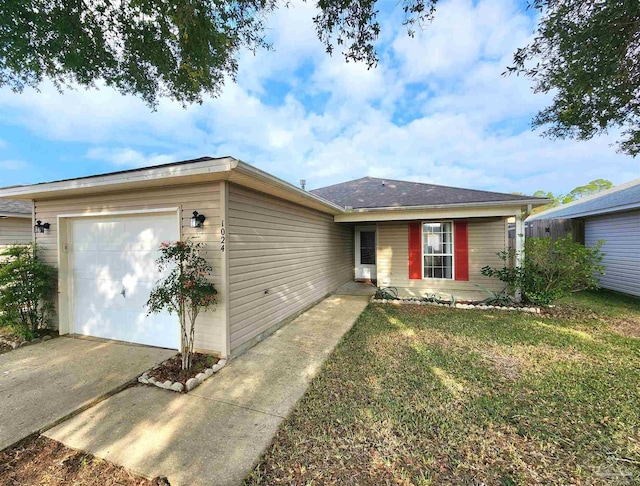 ranch-style house with a garage and a front lawn