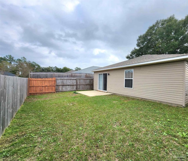 view of yard featuring a patio and a fenced backyard