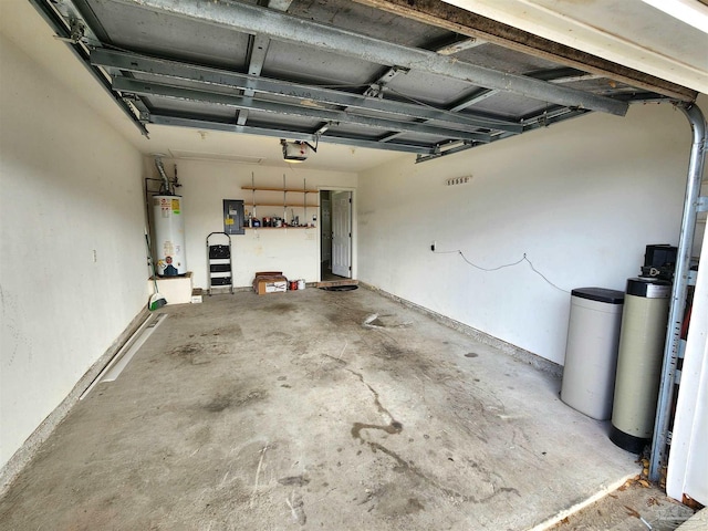 garage with gas water heater, electric panel, and a garage door opener