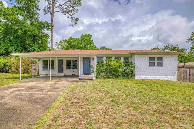 single story home featuring a carport and a front yard