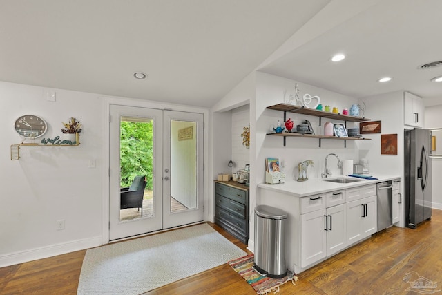 kitchen with stainless steel appliances, dark hardwood / wood-style floors, and sink