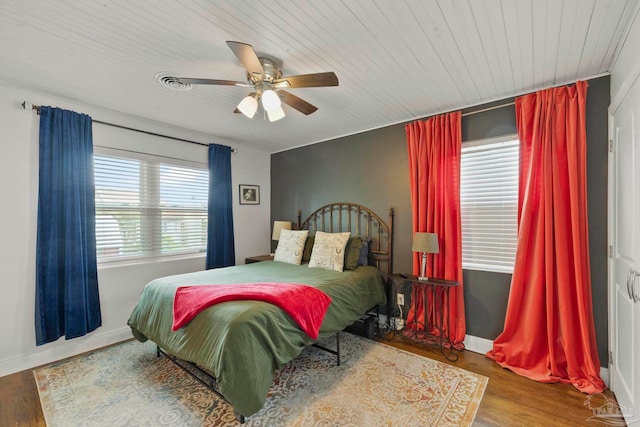 bedroom with wood-type flooring and ceiling fan