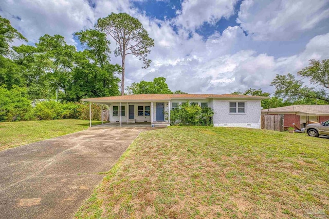 view of front of home with a front yard and a carport