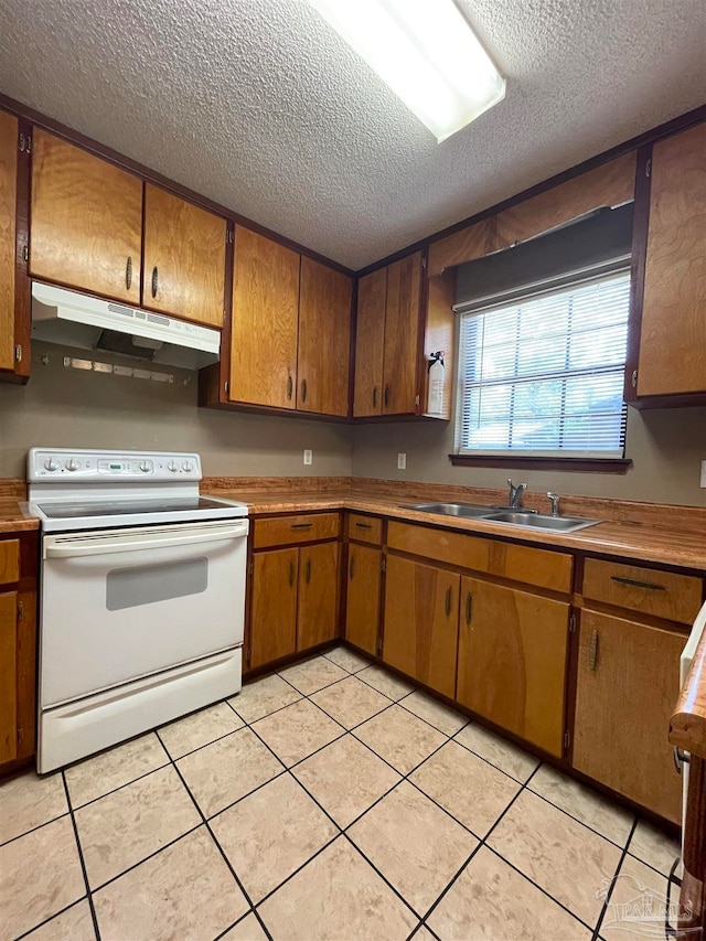 kitchen with sink, white range with electric stovetop, a textured ceiling, and light tile patterned floors