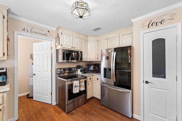 kitchen with ornamental molding, a textured ceiling, stainless steel appliances, dark wood-type flooring, and water heater