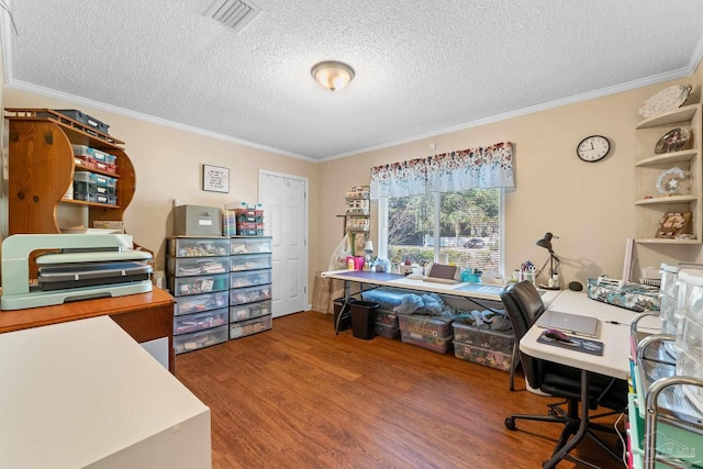 office space featuring hardwood / wood-style floors, crown molding, and a textured ceiling