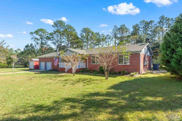 ranch-style house with a front yard and central AC unit