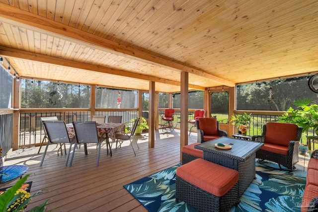 exterior space featuring beamed ceiling, a wealth of natural light, and wood ceiling