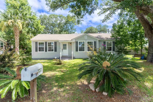 ranch-style home with a front lawn