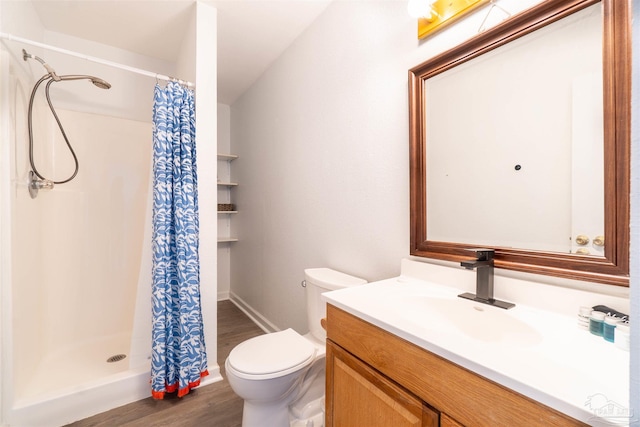 bathroom with wood-type flooring, toilet, vanity, and a shower with shower curtain