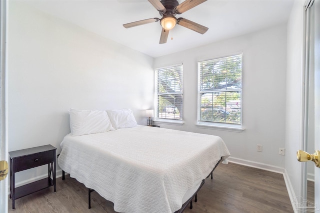 bedroom featuring ceiling fan and dark hardwood / wood-style flooring