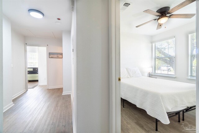 bedroom featuring light hardwood / wood-style flooring and ceiling fan