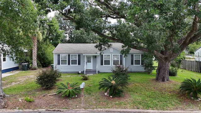 ranch-style home with a front lawn