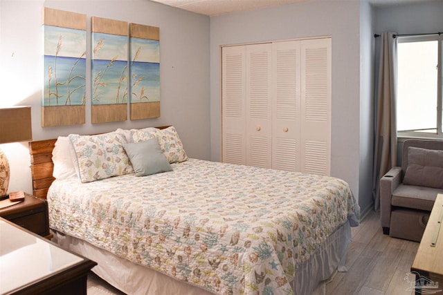 bedroom featuring a closet and light hardwood / wood-style flooring