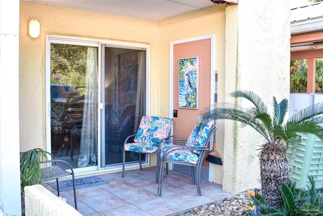 entrance to property with a patio