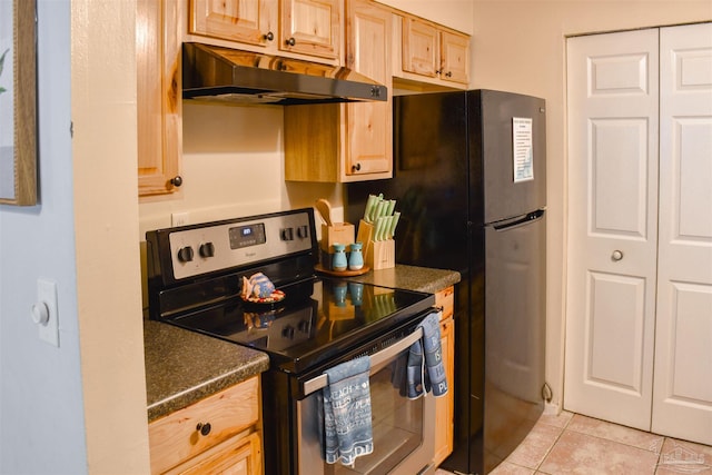 kitchen with light brown cabinetry, light tile patterned flooring, and stainless steel electric range