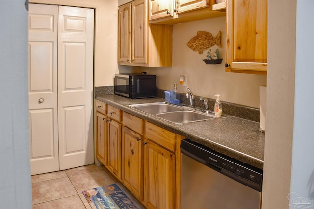 kitchen with sink, light tile patterned flooring, and stainless steel dishwasher