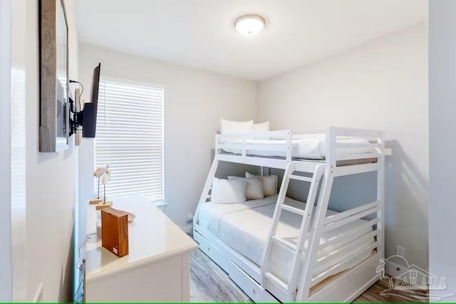 bedroom with wood finished floors