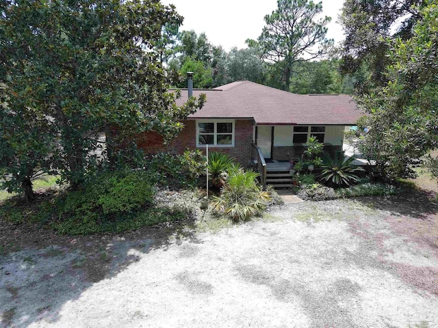 2153 Bergren Rd, Gulf Breeze, FL 32563 - view of front of home featuring covered porch and brick siding