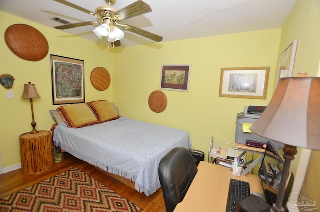 2153 Bergren Rd, Gulf Breeze, FL 32563 - bedroom featuring wood finished floors, a ceiling fan, and an office area