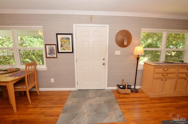 2153 Bergren Rd, Gulf Breeze, FL 32563 - foyer entrance with light wood-style flooring, ornamental molding, and wallpapered walls