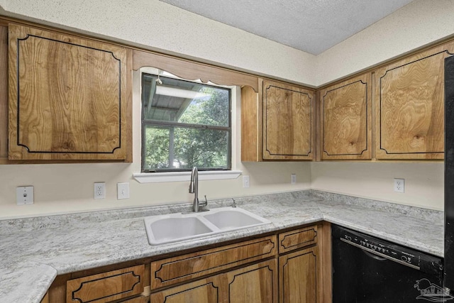 6136 Beasley Rd, Crestview, FL 32536 - kitchen featuring black dishwasher, brown cabinets, light countertops, and a textured ceiling