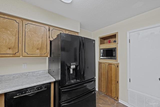 6136 Beasley Rd, Crestview, FL 32536 - kitchen with black appliances, light countertops, a textured ceiling, and built in features
