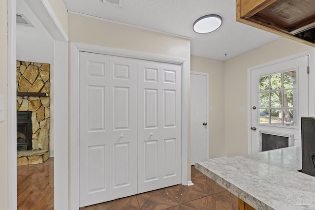 6136 Beasley Rd, Crestview, FL 32536 - kitchen with light countertops and a fireplace