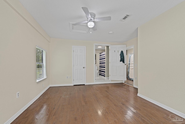 6136 Beasley Rd, Crestview, FL 32536 - unfurnished bedroom featuring hardwood / wood-style flooring and a ceiling fan