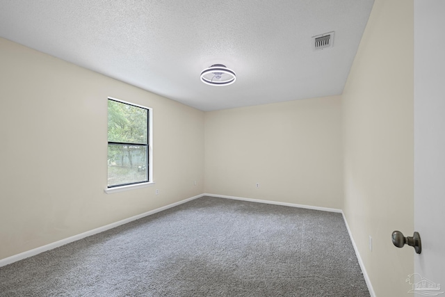 6136 Beasley Rd, Crestview, FL 32536 - carpeted spare room with baseboards and a textured ceiling