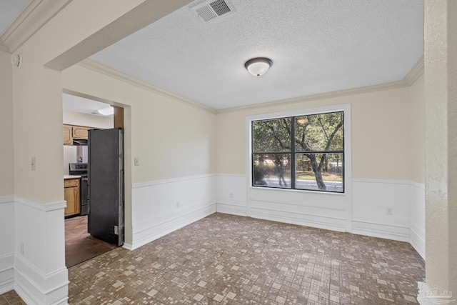 6136 Beasley Rd, Crestview, FL 32536 - spare room with wainscoting, crown molding, a smoke detector, and a textured ceiling