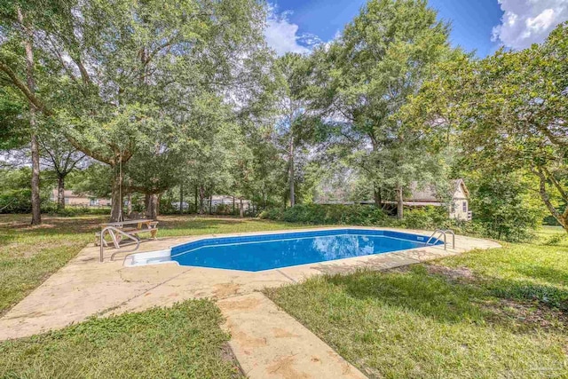 6136 Beasley Rd, Crestview, FL 32536 - outdoor pool featuring a yard, a patio area, and view of scattered trees