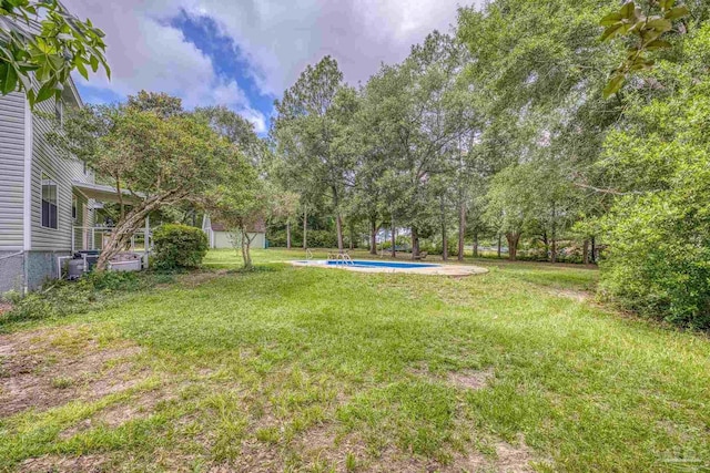 6136 Beasley Rd, Crestview, FL 32536 - view of grassy yard featuring an outdoor pool