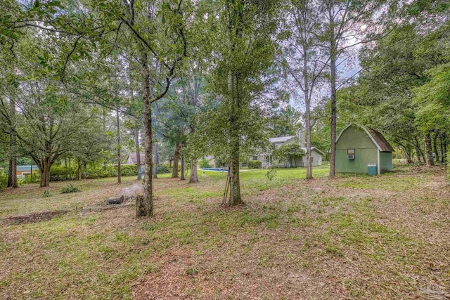 6136 Beasley Rd, Crestview, FL 32536 - view of yard featuring a storage unit