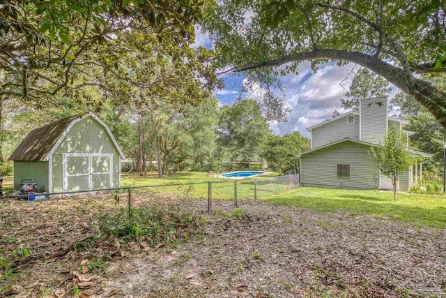 6136 Beasley Rd, Crestview, FL 32536 - view of yard with a shed and a garage