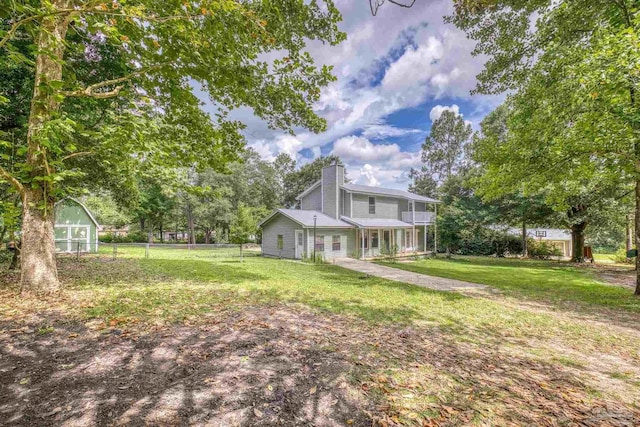 6136 Beasley Rd, Crestview, FL 32536 - view of yard featuring an exterior structure and an outbuilding