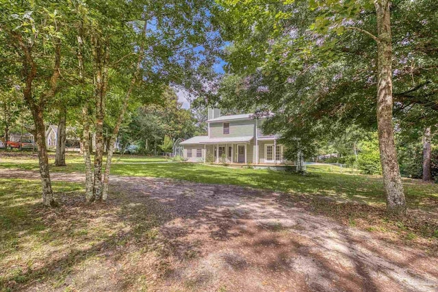 6136 Beasley Rd, Crestview, FL 32536 - view of front of house featuring a front yard and a chimney