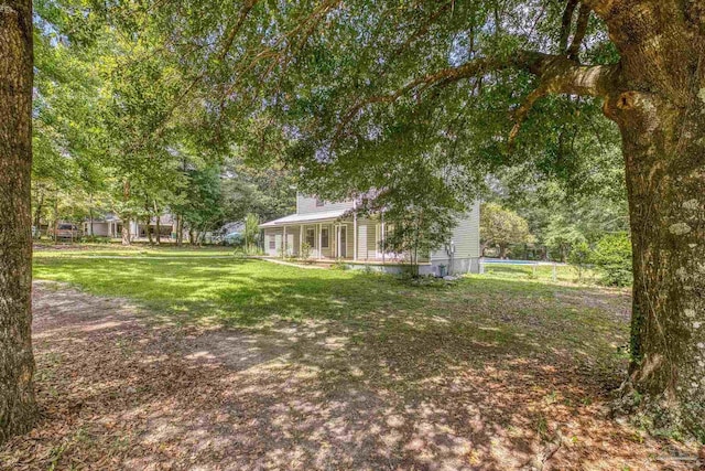 6136 Beasley Rd, Crestview, FL 32536 - view of green lawn featuring a pool