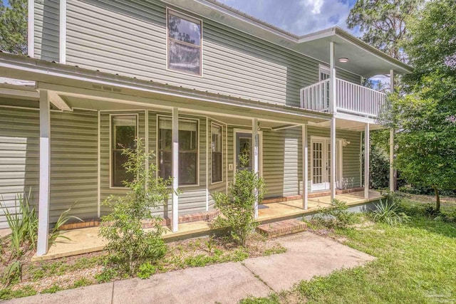 6136 Beasley Rd, Crestview, FL 32536 - view of front of home with covered porch and a balcony