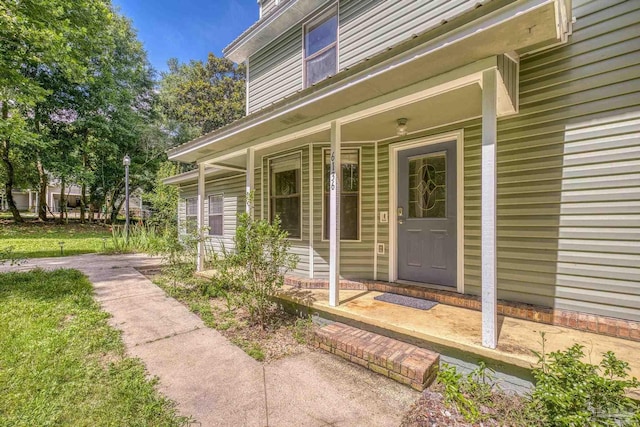 6136 Beasley Rd, Crestview, FL 32536 - doorway to property featuring covered porch