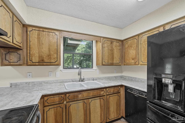 6136 Beasley Rd, Crestview, FL 32536 - kitchen with black appliances, brown cabinets, a textured ceiling, and light countertops