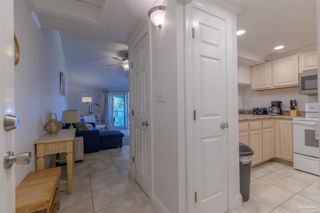 kitchen featuring light tile patterned floors, white range with electric stovetop, ornamental molding, and ceiling fan