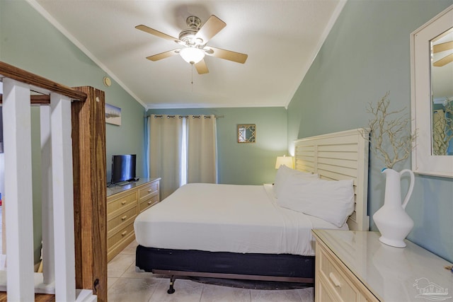 tiled bedroom with ceiling fan, ornamental molding, and lofted ceiling