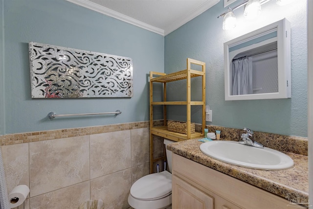 bathroom featuring toilet, ornamental molding, tile walls, and vanity