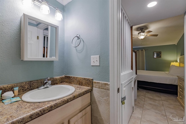 bathroom with ceiling fan, tile patterned floors, and vanity