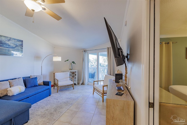 living room featuring ceiling fan, light tile patterned floors, vaulted ceiling, and crown molding