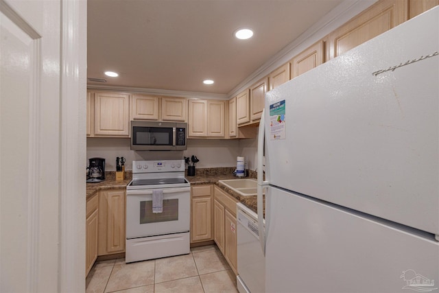 kitchen with sink, white appliances, and light tile patterned floors