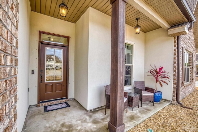 entrance to property with stucco siding